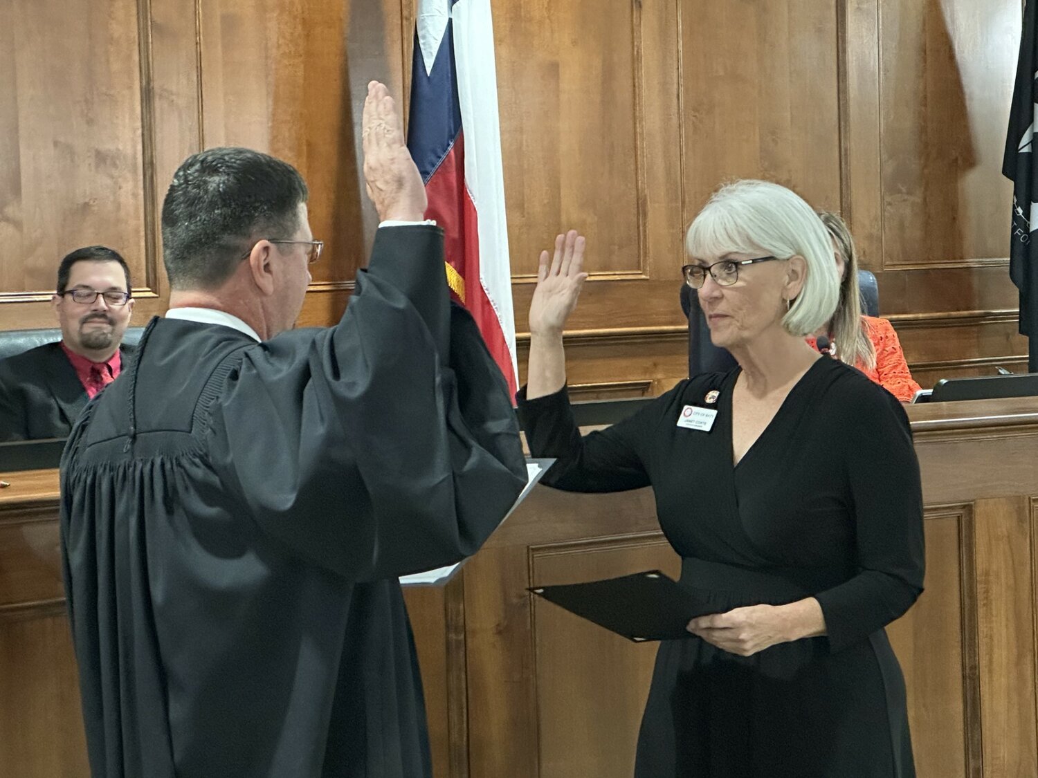 Ward A Council Member Janet Corte takes the oath of office from Katy Municipal Judge Jeffrey Brashear at the May 22 council meeting.